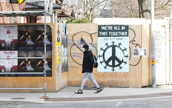A "We're all in this together" sign in Toronto's Parkdale neighbourhood, where some residents are taking part in a rent strike amid the COVID-19 pandemic.