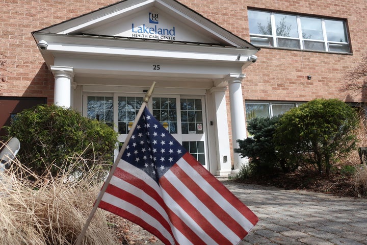 This Wednesday, April 1, 2020, file photo, shows an entrance to the Lakeland Health Care Center, a nursing home in Wanaque, N.J. Multiple people at the facility have died of COVID-19, the disease caused by the new coronavirus, according to the borough's Mayor Dan Mahler. Several others, including residents and staff members, are infected. (AP Photo/Ted Shaffrey, File)