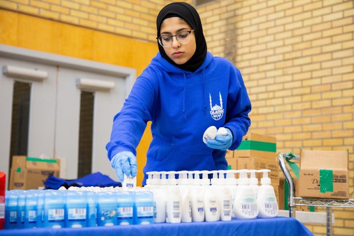A volunteer from Islamic Relief Canada readies donations of soap and deoderant for those in need. 