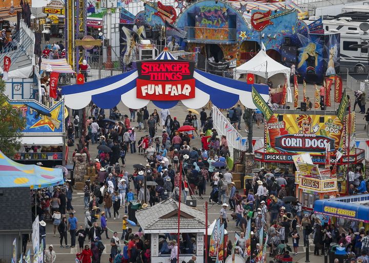 Crowds flock to the midway at the Calgary Stampede in Calgary on July 7, 2019. The Calgary Stampede has been cancelled this year because of COVID-19. 