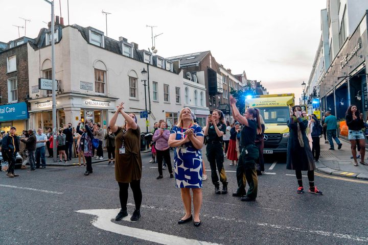 In London, members of the public take part in a national "clap for carers" to show thanks for the work of Britain's National Health Service workers, April 23, 2020.