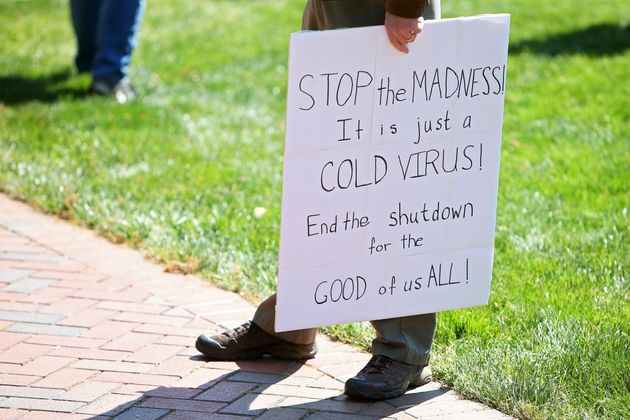 Protesters rally against stay-at-home orders related to the coronavirus pandemic at Capitol Square in Richmond, Virginia 