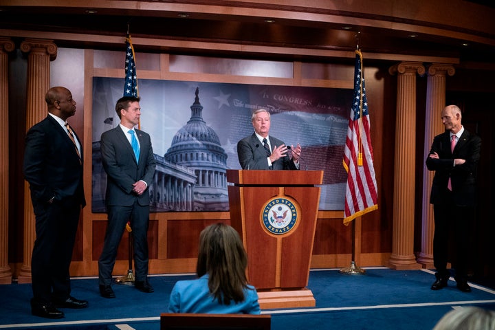 Sen. Lindsey Graham (R-S.C.) speaks while flanked by Sens. Tim Scott (R-S.C.), Ben Sasse (R-Neb.) and Rick Scott (R-Fla.) during a news conference at the U.S. Capitol on March 25.