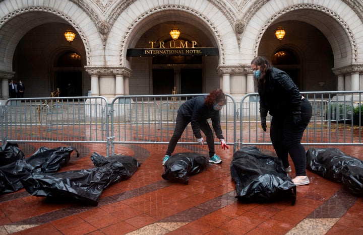 Protesters stop at the Trump International Hotel to deliver fake body bags in Washington, D.C., on April 23, 2020.