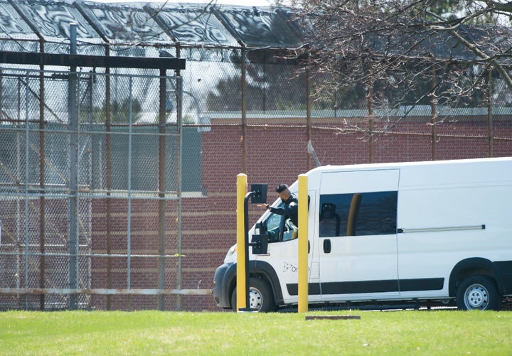 A transportation van arrives at the Ontario Correctional Institute in Brampton, Ont. on April 20, 2020. An outbreak of COVID-19 has infected inmates and staff.