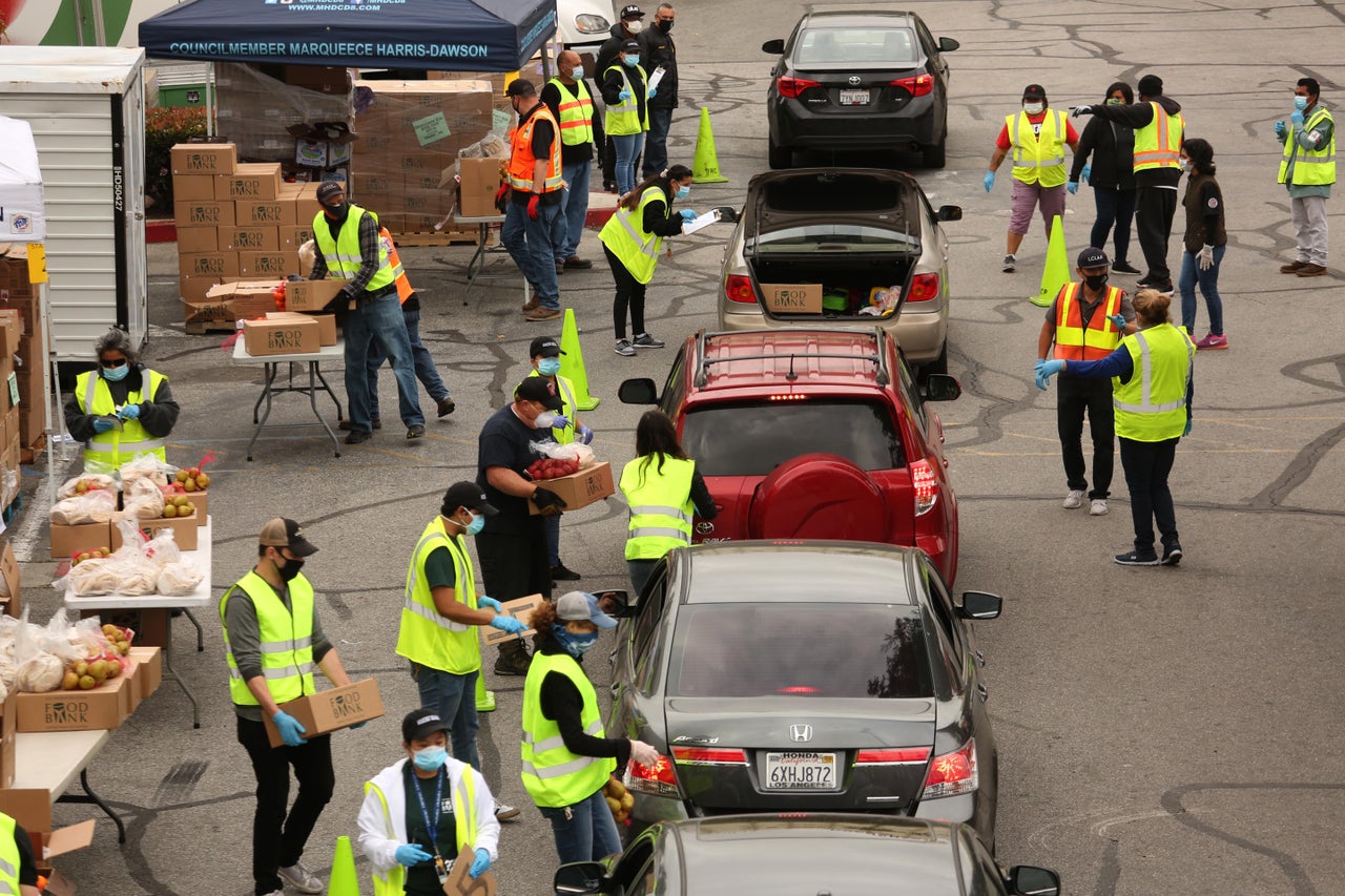 Cars line up at a shopping center in Los Angeles for food distribution for more than 2,500 families affected by the COVID-19 crisis.