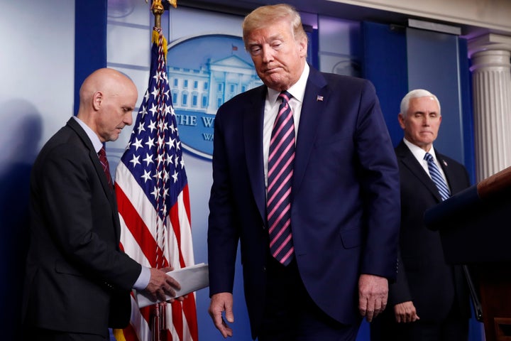 Trump steps away from the podium at the coronavirus briefing on Friday.