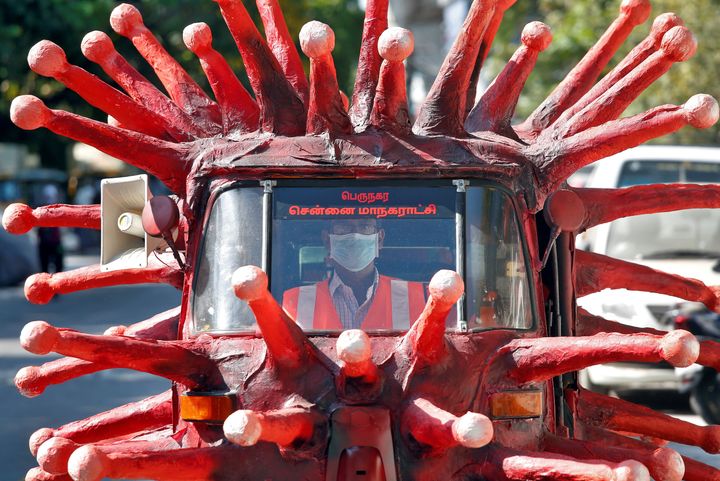 A man drives an auto-rickshaw depicting the coronavirus to create awareness about staying at home during a nationwide lockdown to slow the spreading of the coronavirus disease in Chennai, India, April 23, 2020.