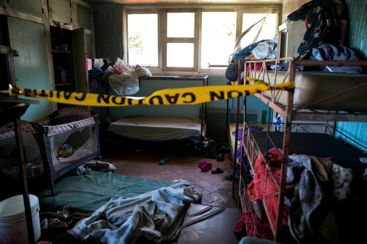 In this Feb. 14, 2020 file photo, police tape hangs inside an empty room at a children's home run by the Church of Bible Unde