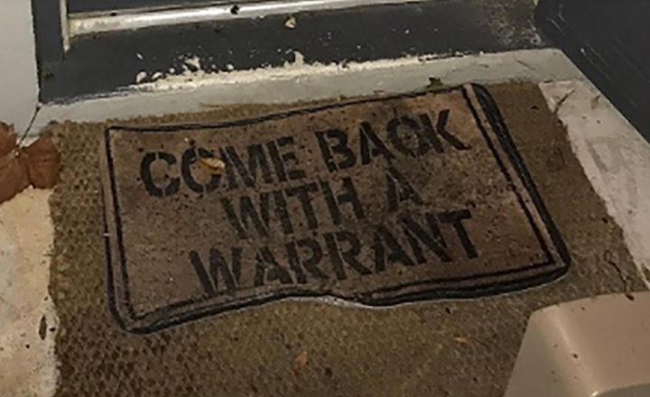 A welcome mat at the front door of a Florida home read “come back with a warrant” — and that’s just what deputies did before