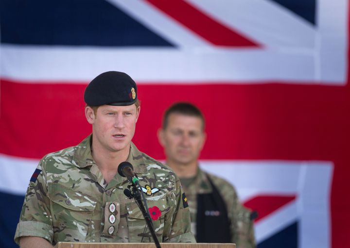 Prince Harry speaks at a Remembrance Sunday service at Kandahar Airfield Nov. 9, 2014, in Kandahar, Afghanistan. Harry served 10 years in the military.