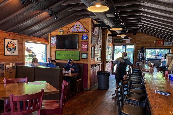 Customers sit and eat at a restaurant in Atlanta on April 27, 2020. 