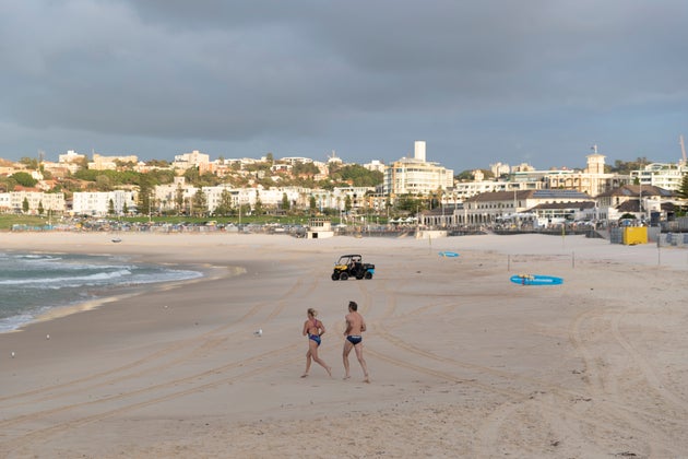 SYDNEY, AUSTRALIA - APRIL 28: The first swimmers return to the water at Bondi beach on April 28, 2020 in Sydney, Australia. Waverley Council reopened Bondi, Bronte and Tamarama beaches today, with COVID-19 social distancing rules still in place. The beaches will be open from 7am to 5pm for swimmers and surfers on weekdays, but will remain closed on weekends. Several beaches in Sydney's Eastern suburbs were closed March 28, after large crowds were seen gathering at Bondi Beach despite social distancing orders in place to slow the spread of COVID-19. (Photo by Brook Mitchell/Getty Images)