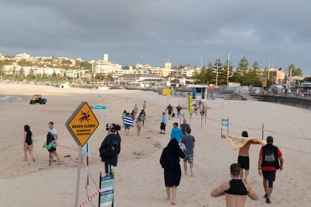 SYDNEY, AUSTRALIA - APRIL 28: Swimmers return to Bondi beach on April 28, 2020 in Sydney, Australia. Waverley Council reopened Bondi, Bronte and Tamarama beaches today, with COVID-19 social distancing rules still in place. The beaches will be open from 7am to 5pm for swimmers and surfers on weekdays, but will remain closed on weekends. Several beaches in Sydney's Eastern suburbs were closed March 28, after large crowds were seen gathering at Bondi Beach despite social distancing orders in place to slow the spread of COVID-19. (Photo by Brook Mitchell/Getty Images)