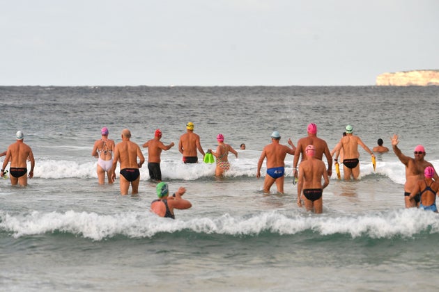 Beachgoers enjoy their first swim after Bondi Beach reopened following a five week closure in Sydney on April 28, 2020, amid the novel coronavirus pandemic. - Swimmers and surfers returned to Sydney's famed Bondi Beach almost six weeks after it was closed amid a spike in coronavirus cases. (Photo by Saeed KHAN / AFP) (Photo by SAEED KHAN/AFP via Getty Images)