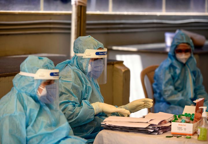 Medical worker wearing PPE at a health camp organised for journalists at Golden Tulip on April 27, 2020 in New Delhi.