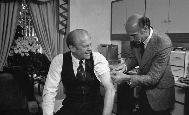 President Gerald Ford receives a swine flu vaccine from his White House physician, William Lukash, on Oct. 14, 1976.