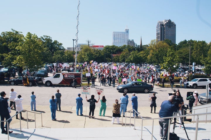 Health care workers at their counterprotest across from the “ReOpen NC” rally in Raleigh.
