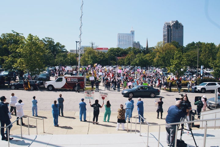 Health care workers at their counterprotest across from the “ReOpen NC” rally in Raleigh. 