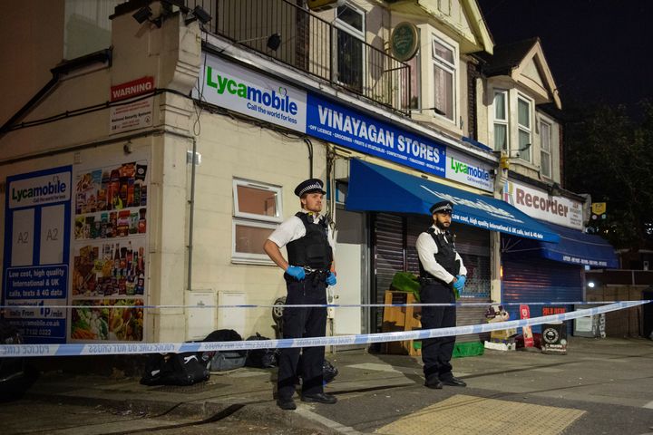 Police attend the scene in Ilford, east London.