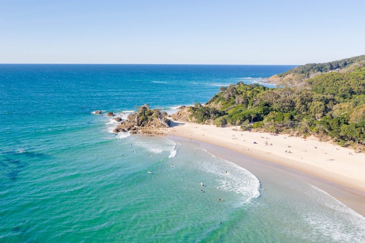 A view of a busy beach at Byron Bay.