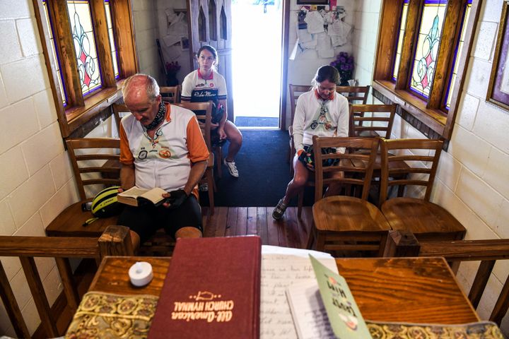 Worshippers offer prayers inside the "Smallest Church In America" in Townsend, Georgia, during the novel coronavirus pandemic on April 26, 2020.