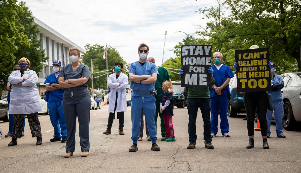 Counter-protesters during a Reopen NC rally in downtown Raleigh (Travis Long/The News & Observer via AP)