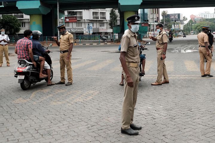 Policemen check motorcyclists in Kochi, on March 25, 2020. 