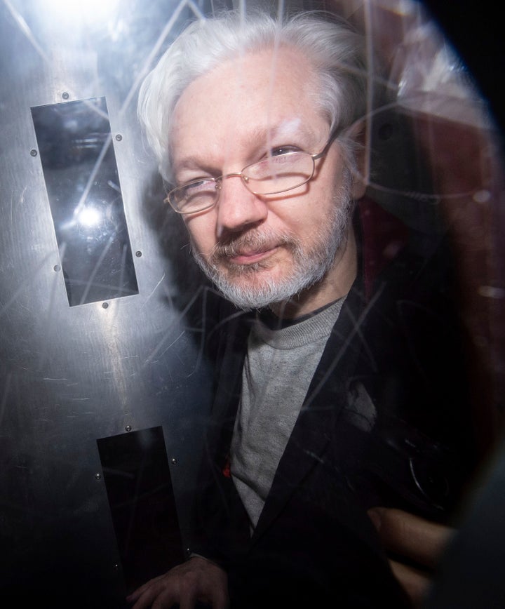 Wikileaks founder Julian Assange leaves in a prison van after appearing at Westminster Magistrates Court, for an administrative hearing in London, Monday, Jan. 13, 2020. (Dominic Lipinski/PA Wire via AP)