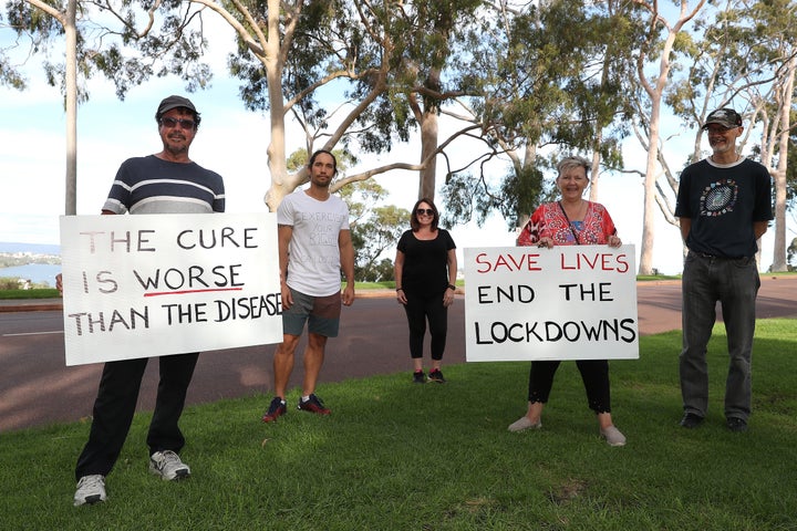 PERTH, AUSTRALIA - APRIL 25: Representatives for Citizens 4 Health Awareness hold a placards to promote Exercise Your Rights in Kings Park on April 25, 2020 in Perth, Australia. (Photo by Paul Kane/Getty Images)