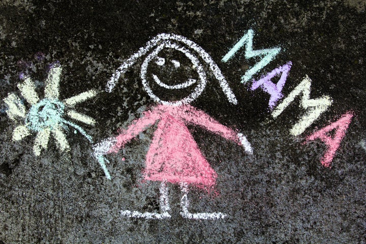 chalk drawing on asphalt: Cute mother portrait and word MAMA