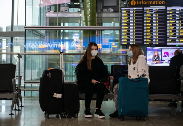 Face masks will likely be a common sight at airports and other high-traffic places.