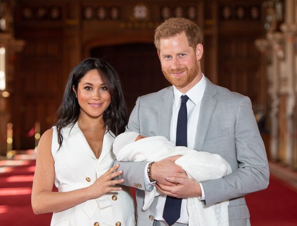 Harry and Meghan with their newborn son, Archie Harrison Mountbatten-Windsor, in St. George's Hall at Windsor Castle on May 8