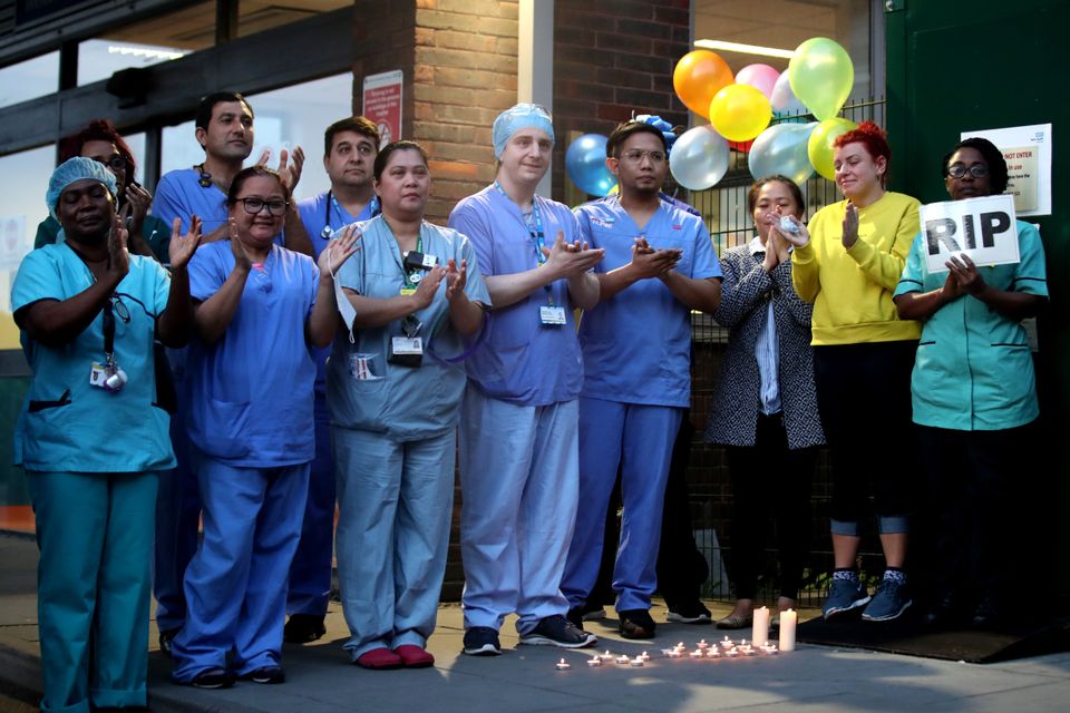 NHS workers clap outside Newham University Hospital on April 23.