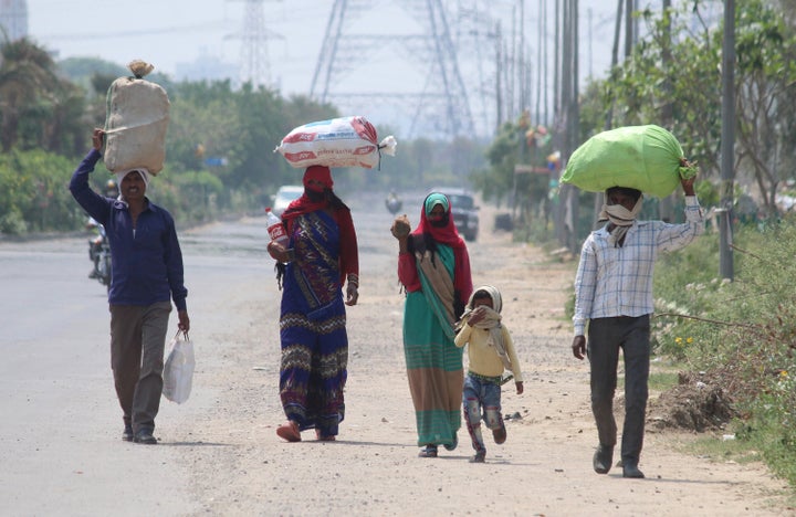 Stranded migrant workers leave for their native place in Tikamgarh, Madhya Pradesh, during lockdown, at Sector 70, SPR Road, on April 29, 2020 in Gurugram.