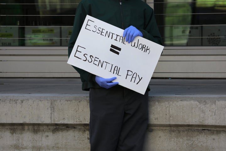 A grocery store worker at a protest in Boston on April 7.