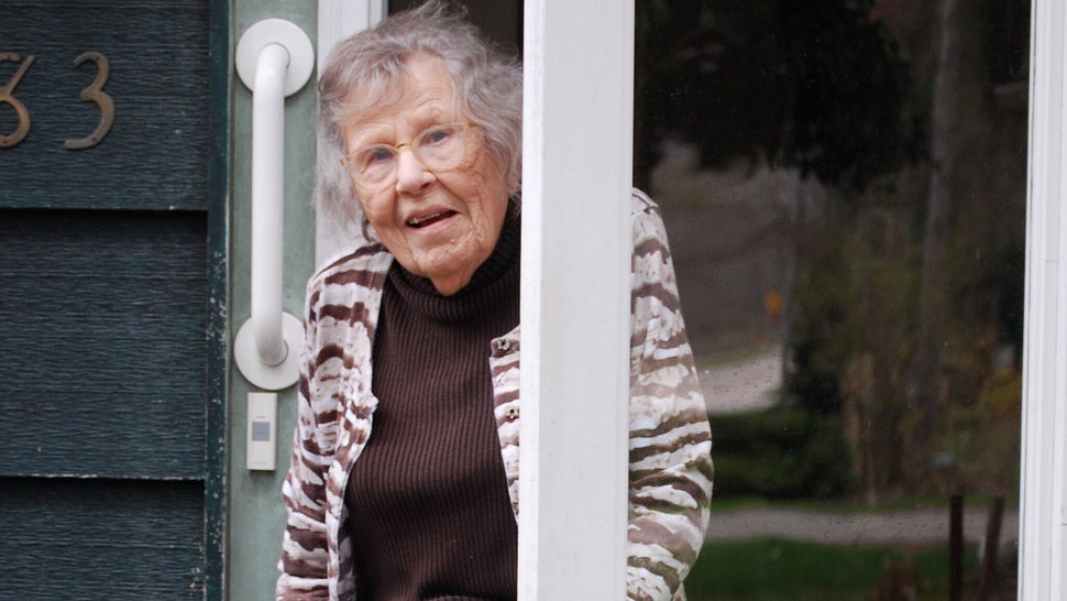 Beverly Sharp poses for a portrait outside her home in Douglas, Michigan. 