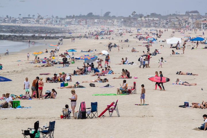 It looked much like any other day at Newport Beach in California on Tuesday despite shelter-in-place orders.