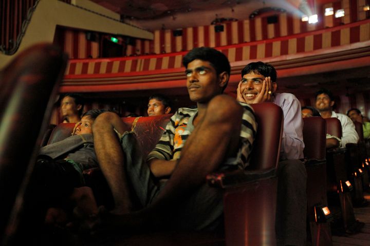 Cinema goers watch Bollywood movie "Dilwale Dulhania Le Jayenge" (The Big Hearted Will Take the Bride), starring actor Shah Rukh Khan, inside Maratha Mandir theatre in Mumbai July 11, 2010. 