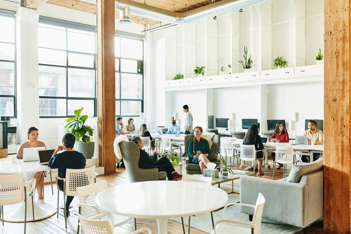 Interior view of businesspeople working in coworking office