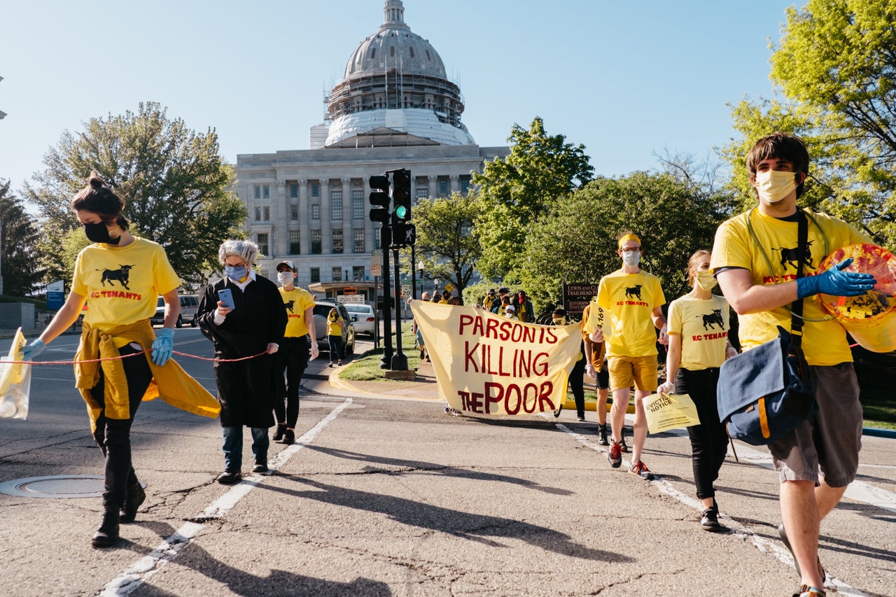 Cancel Rent protesters march from the Missouri state Capitol to the Governor's Mansion to place an eviction notice on the front gates.