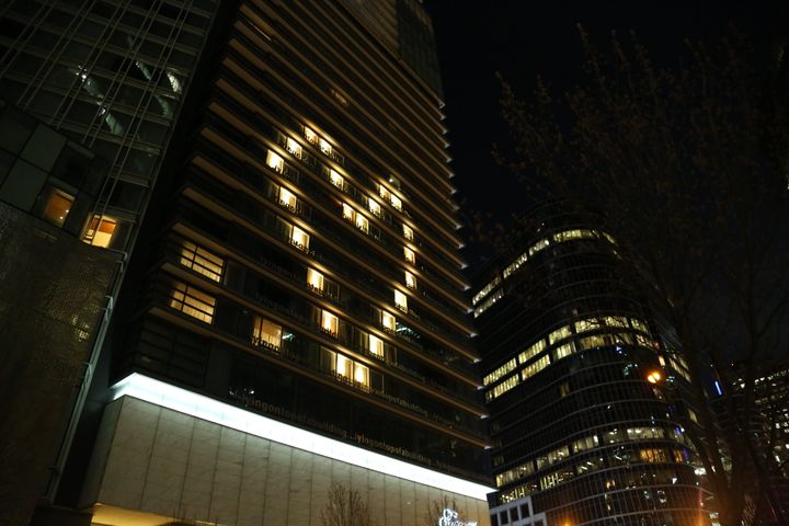 A building lights up its some of the rooms in the shape of a heart to show support for front-line workers during the COVID-19 pandemic, in Vancouver, B.C., on April 6, 2020.