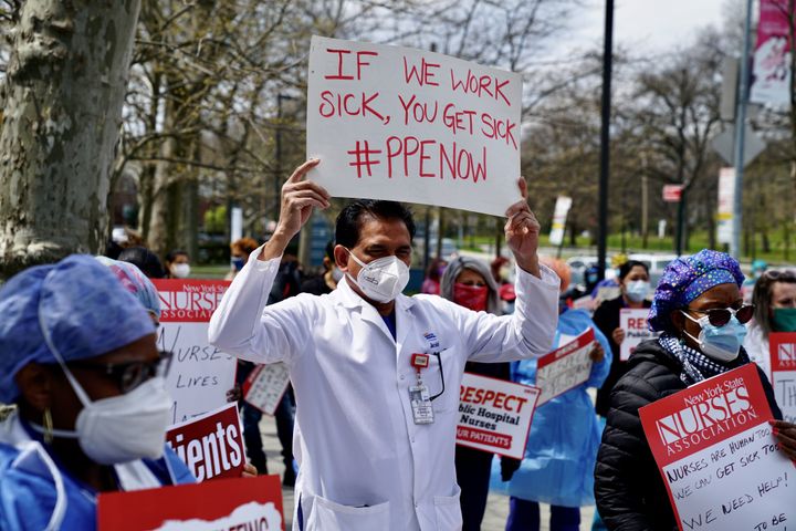 Public health workers, doctors and nurses protest over lack of sick pay and personal protective equipment (PPE) outside a hospital in the borough of the Bronx on April 17 in New York, NY.