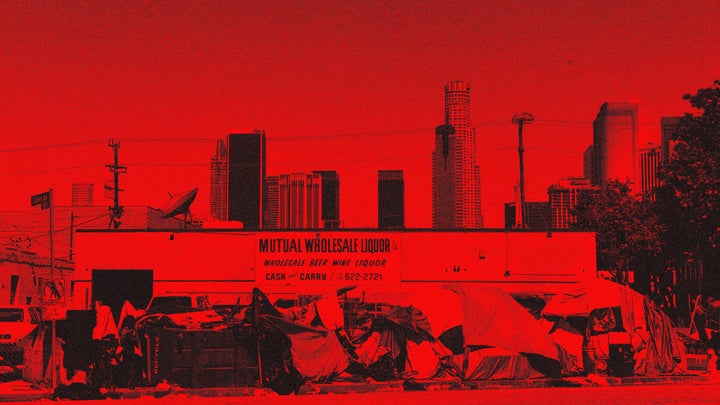 Tents housing the homeless line a street in downtown Los Angeles last month. Los Angeles, which has one of the largest homeless populations in the country, is trying to move 15,000 homeless individuals to hotels or emergency shelters in an effort to prevent the spread of COVID-19.