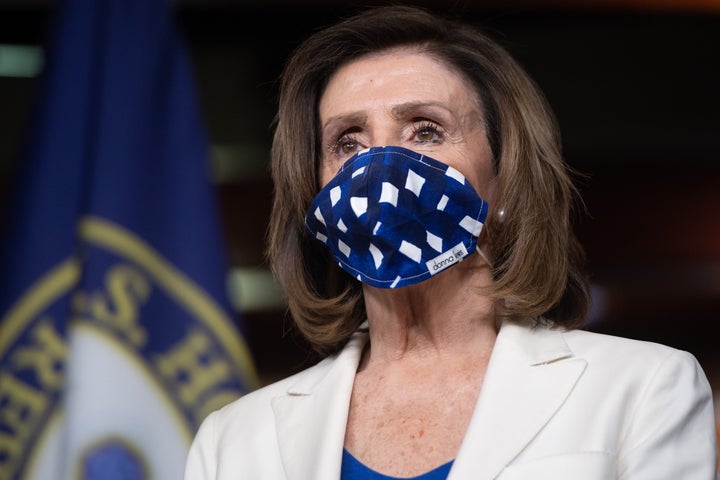 Speaker Nancy Pelosi wears a mask to protect herself and others from COVID-19 at her weekly press conference.