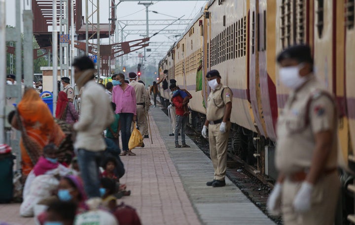 Migrant workers deboard from a special train that arrived from Nasik during lockdown, at Misrod railway station in Bhopal on May 2, 2020.