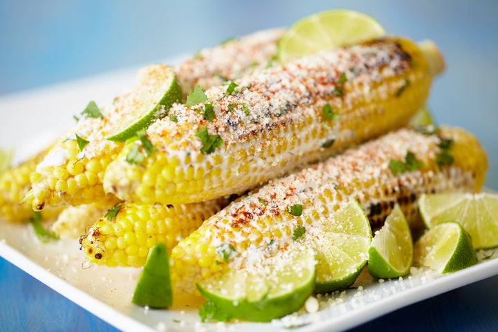 Mexican street corn on rectangular platter. 