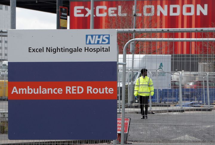 A signpost directs ambulances to the NHS Nightingale Hospital at the ExCel centre in London, Friday April 3, 2020. 