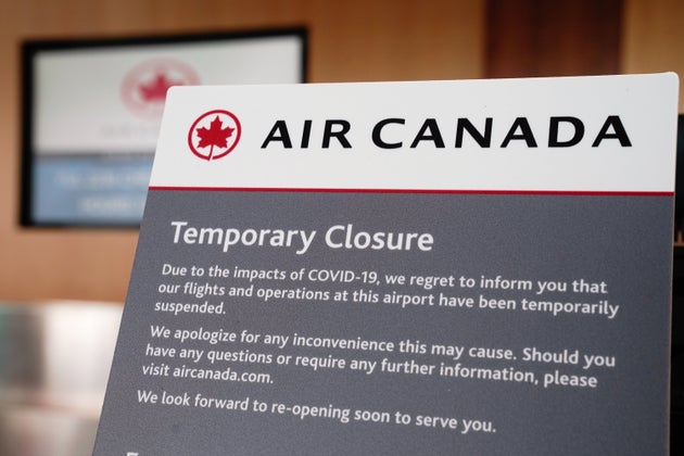 Air Canada signage appears at a ticket counter at San Diego International Airport on April 27,