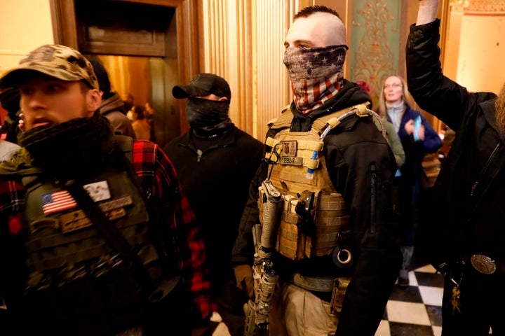 Protesters try to enter the Michigan House of Representatives chamber and are kept out by state police after the American Patriot Rally organized by Michigan United for Liberty in Lansing, Michigan, on April 30, 2020.